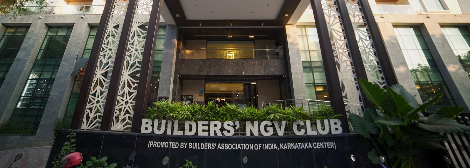 A modern building exterior with large windows and architectural details.