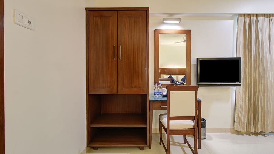 cupboard and looking mirror in deluxe room