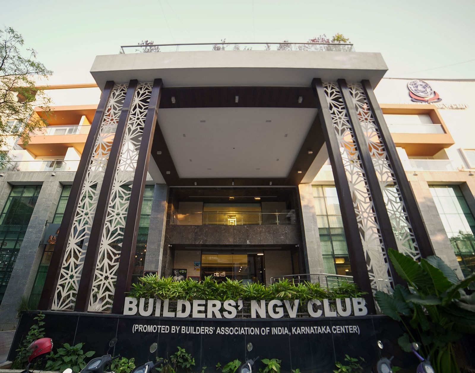 A modern building exterior with large windows and architectural details.