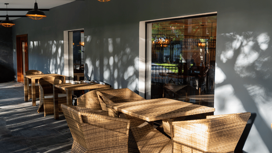 corner view image of the seating area on the porch of Mekong restaurant at Darza Resorts