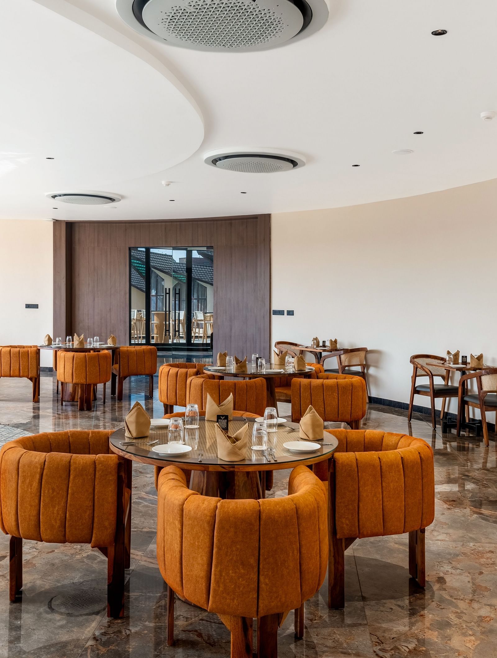 Fine Dine with cosy seating arrangements and a modern interior design at The Qualia Resort Club & Brewery, Udaipur.