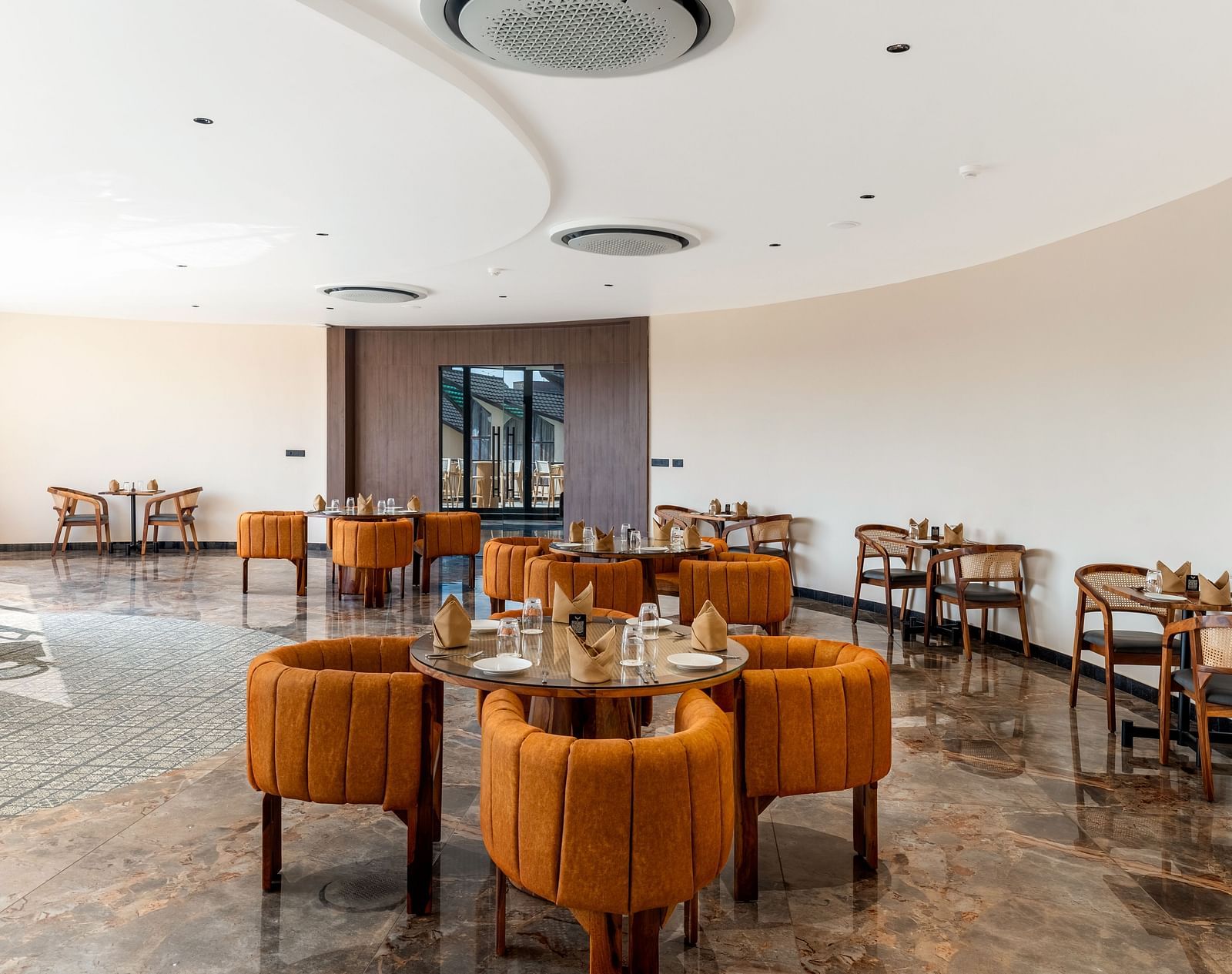Fine Dine with cosy seating arrangements and a modern interior design at The Qualia Resort Club & Brewery, Udaipur.