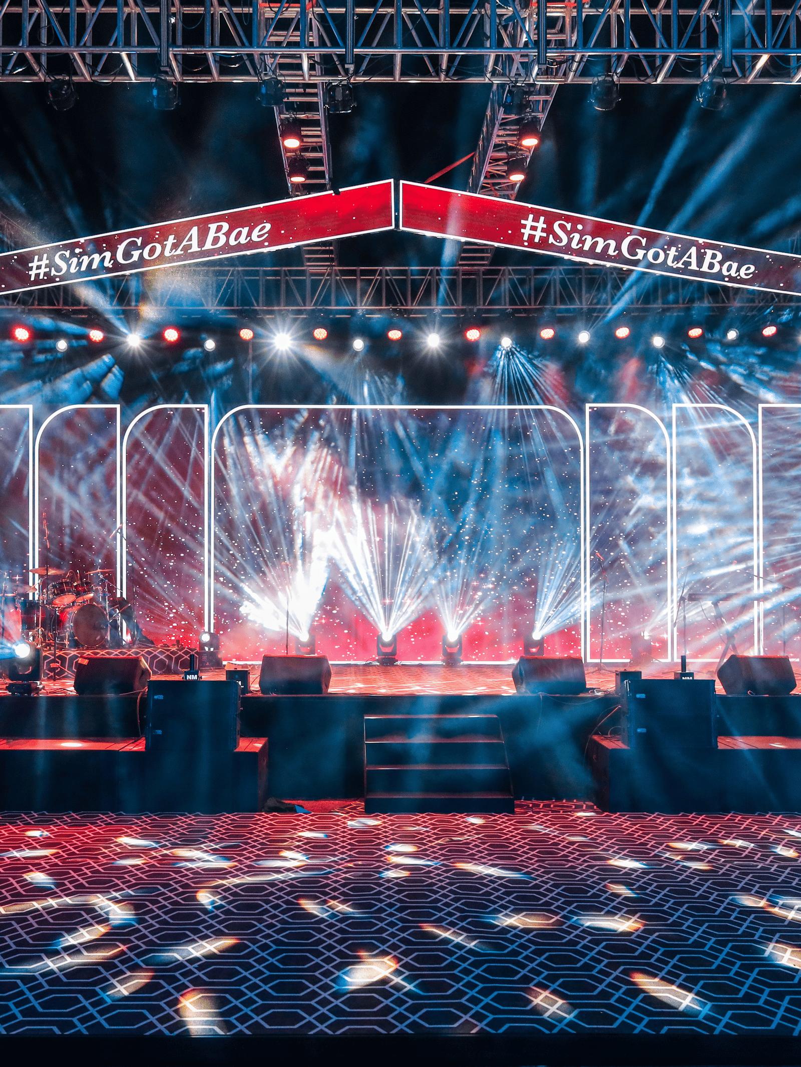 Illuminated stage with light beams and LED panels at Ananta Spa and Resorts, Jaipur.