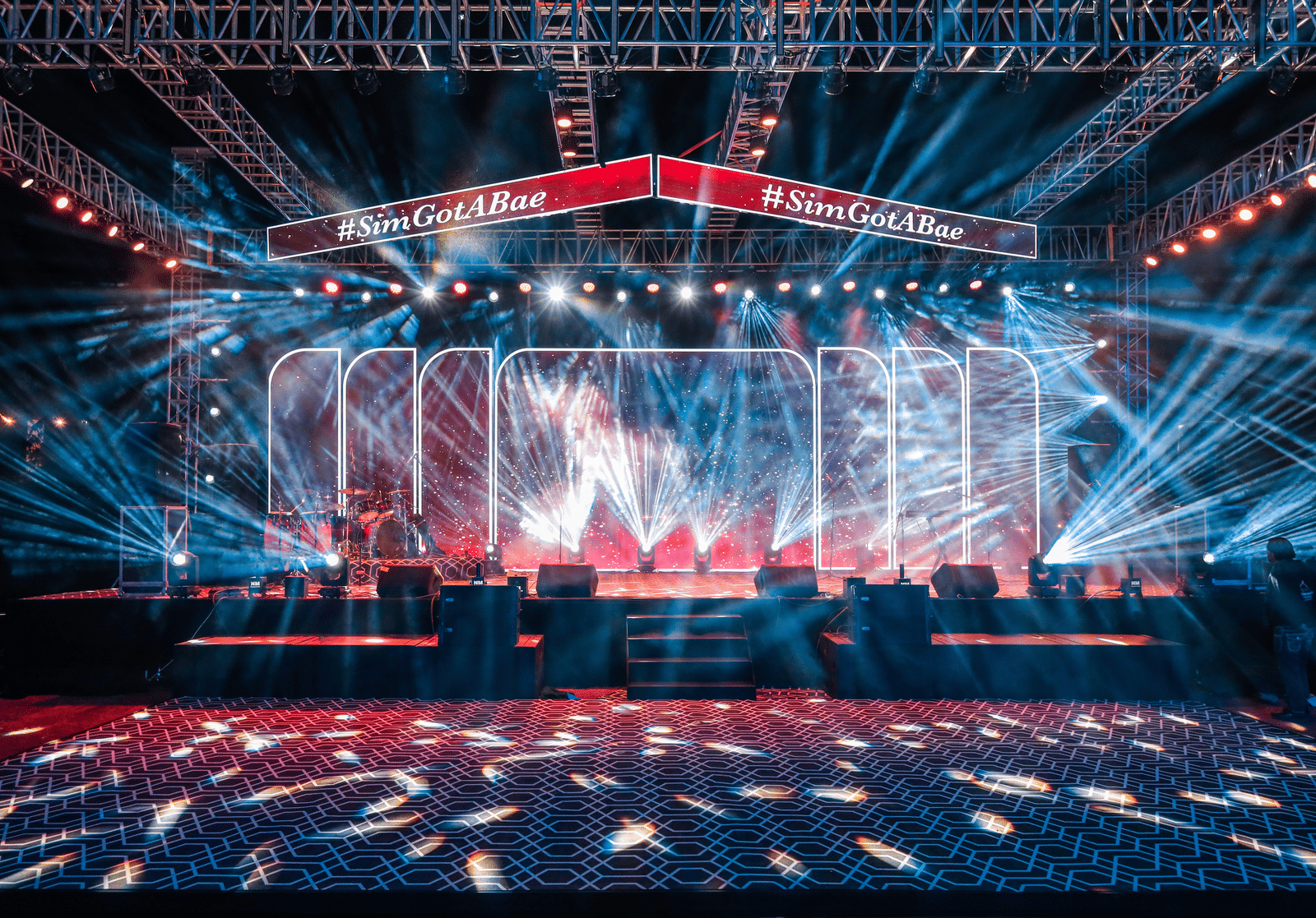 Illuminated stage with light beams and LED panels at Ananta Spa and Resorts, Jaipur.