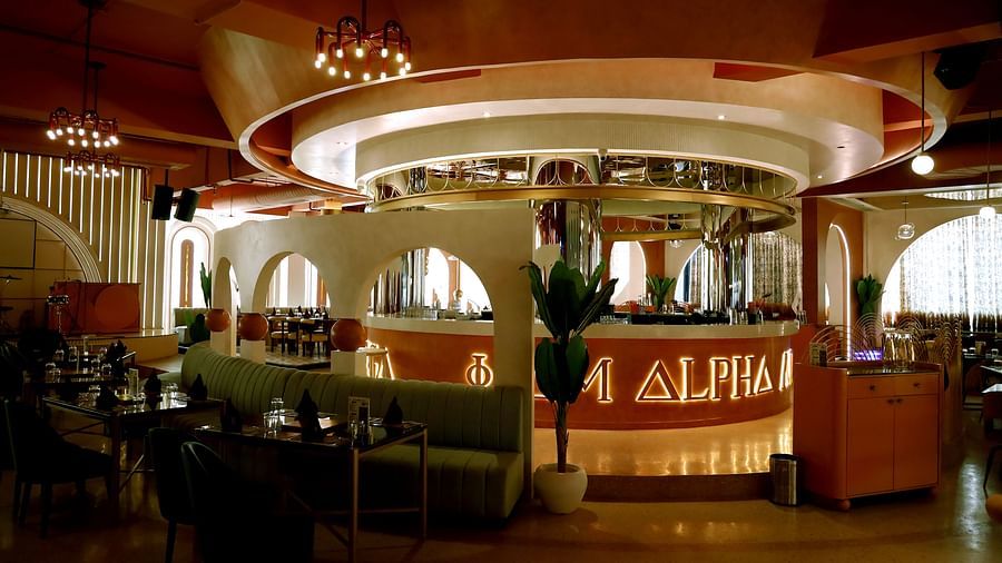 An image of a restaurant featuring seating area and a counter behind - Themis Barbecue House, Ambala