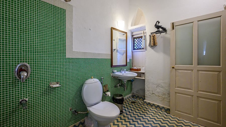 Hill Fort Kesroli 14th Century Alwar - interior view of the Tota Mahal - Garden View - Garden View Washroom featuring a commode, a wash basin and a mirror 