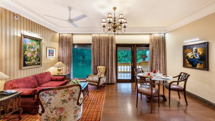 Spacious and elegantly furnished suite living room with chandelier at Mayfair Lagoon
