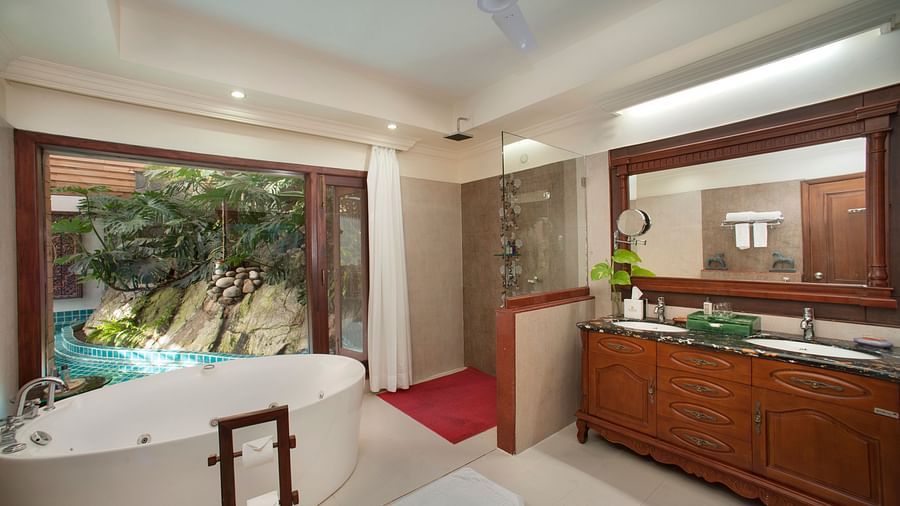 the bathtub and the wash basin area of a bathroom 1 - Mayfair Spa Resort & Casino Gangtok 1
