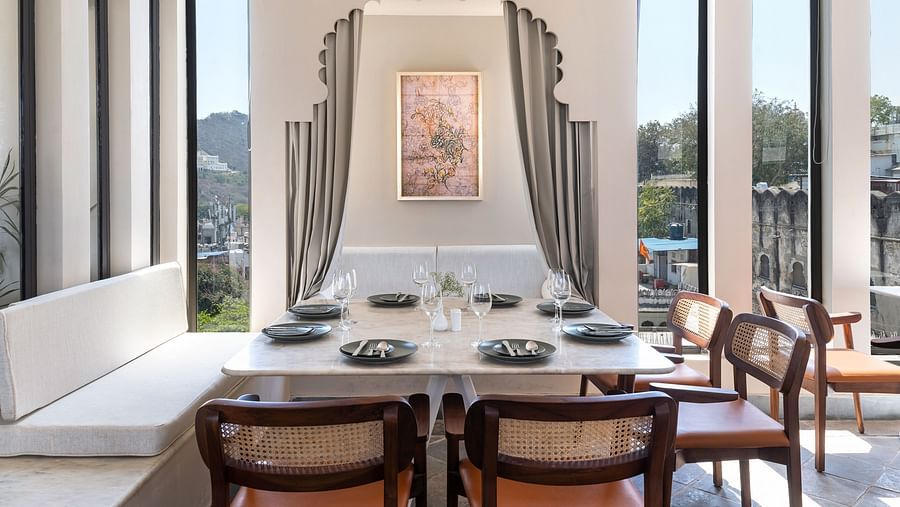 Seating arrangements inside a restaurant at Manuscript - Jhilwara Haveli, Udaipur