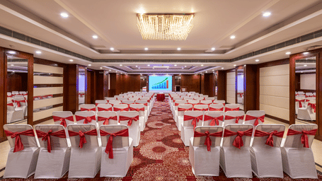 Chancellor hall with ample seating arrangement, bright lighting, carpet flooring and good audiovisual at Lords Plaza Jaipur.