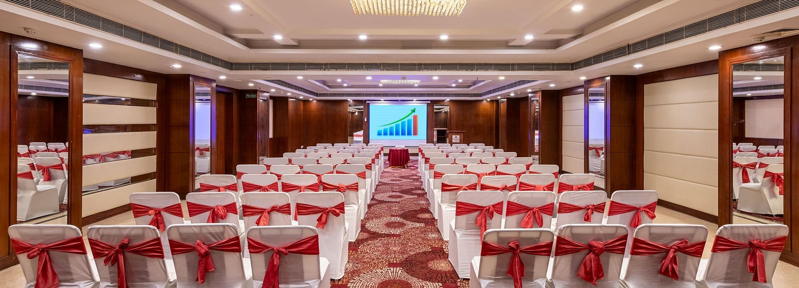Chancellor hall with ample seating arrangement, bright lighting, carpet flooring and good audiovisual at Lords Plaza Jaipur.