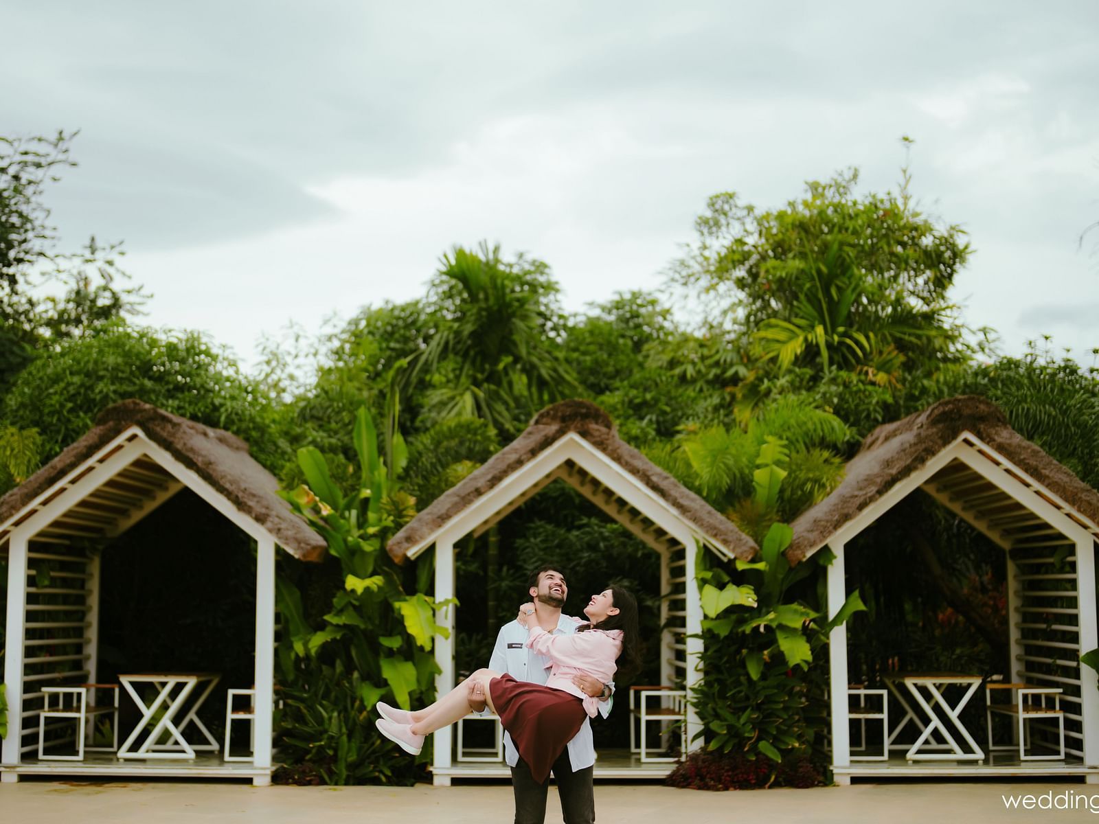 image of a couple laughing as the guy lifts up the woman at darza resorts