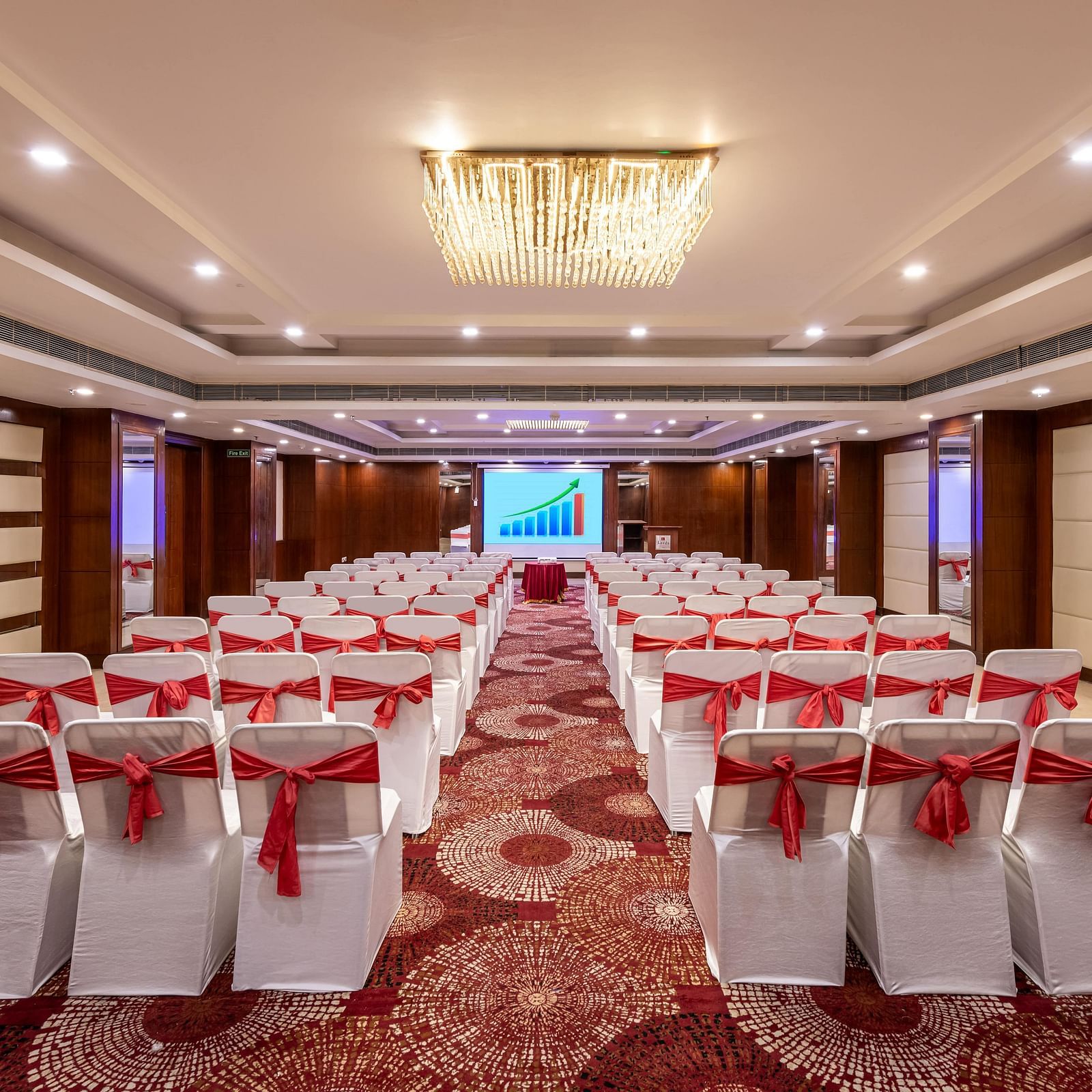 Chancellor hall with ample seating arrangement, bright lighting, carpet flooring and good audiovisual at Lords Plaza Jaipur.