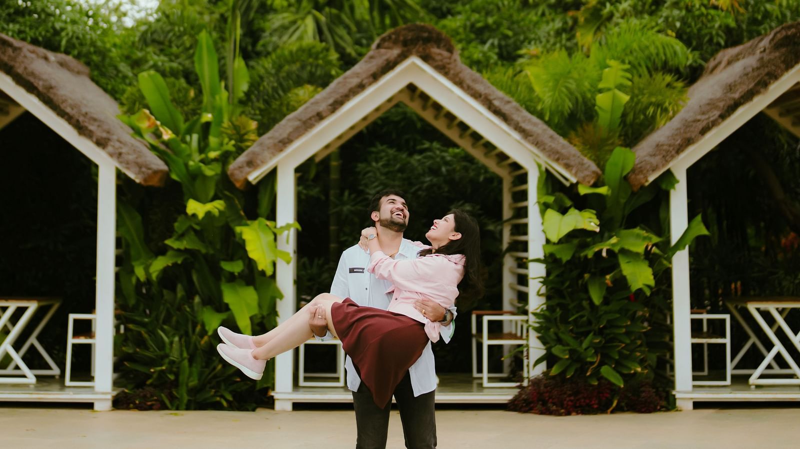 image of a couple laughing as the guy lifts up the woman at darza resorts
