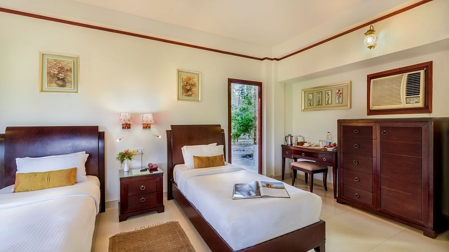 Premium Twin Room featuring two beds and sofas at The Riverwood Forest Retreat, Dooars 2