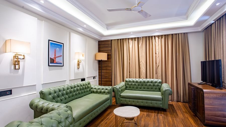 sofas with a table in centre and table in the centre - Wedlock Greens Hotel Resorts Dhanbad