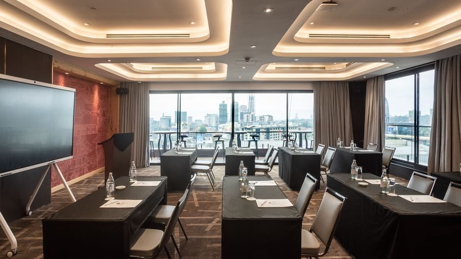 Seminar room at Best Western Premier Westlands hotel, equipped with tiered seating, modern lighting, and large windows for natural light.
