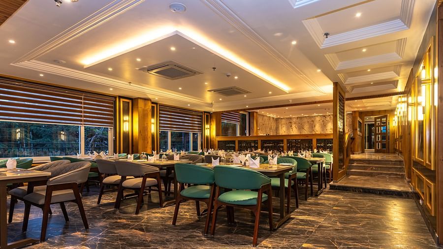 An image of a restaurant with seating arrangement and tables laid out with cutlery - The Belvedere Himalayan Retreat, McLeodganj