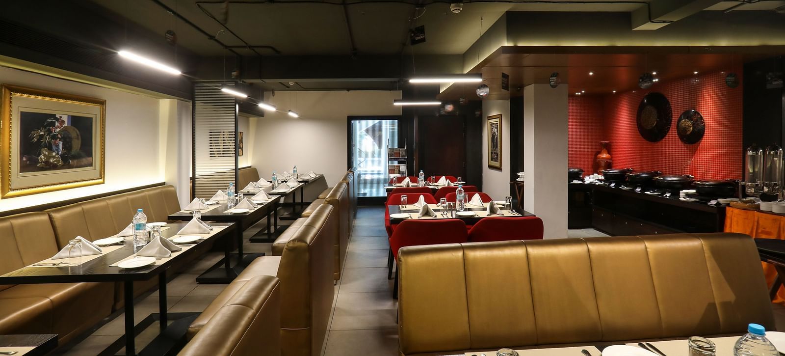 Tables and chairs in clusters in a restaurant - Mango Hill Central, Chennai