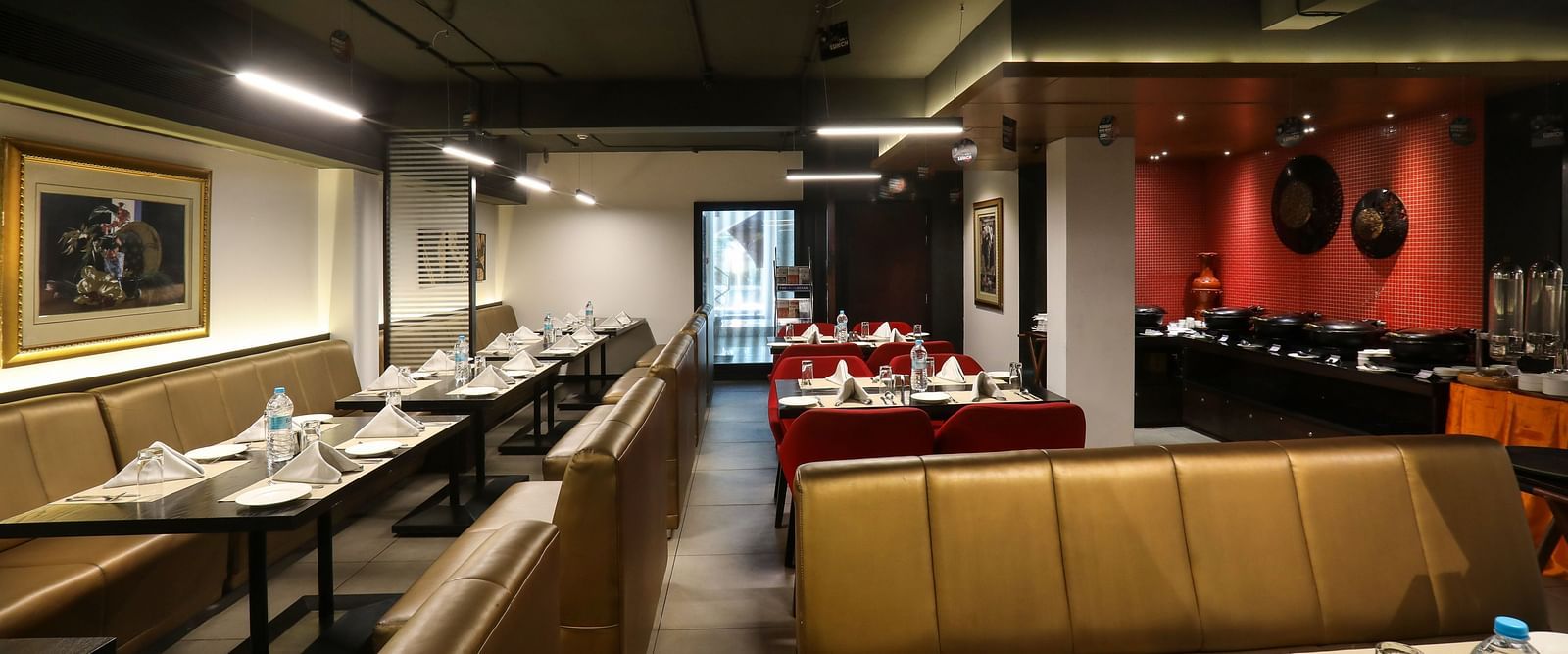 Tables and chairs in clusters in a restaurant - Mango Hill Central, Chennai