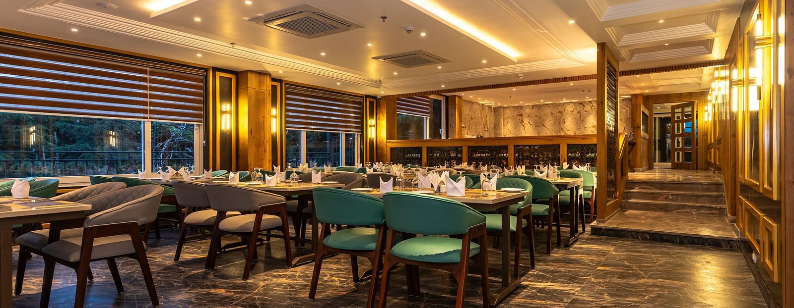 An image of a restaurant with seating arrangement and tables laid out with cutlery - The Belvedere Himalayan Retreat, McLeodganj