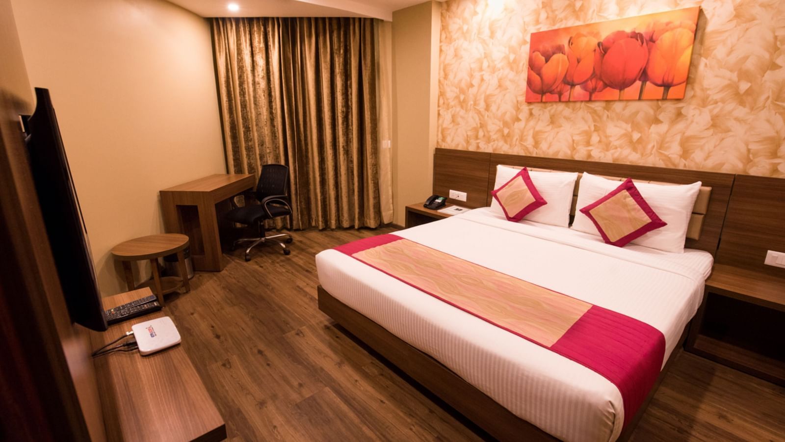 Suites Room with Complimentary Wi-Fi in a hotel room with separate living room that features a couch and a separate bedroom with a queen size bed - Le ROI Digha Hotel West Bengal4