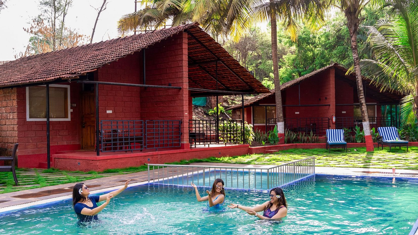 women playing in the swimming pool at Lotus Eco Beach Resort.