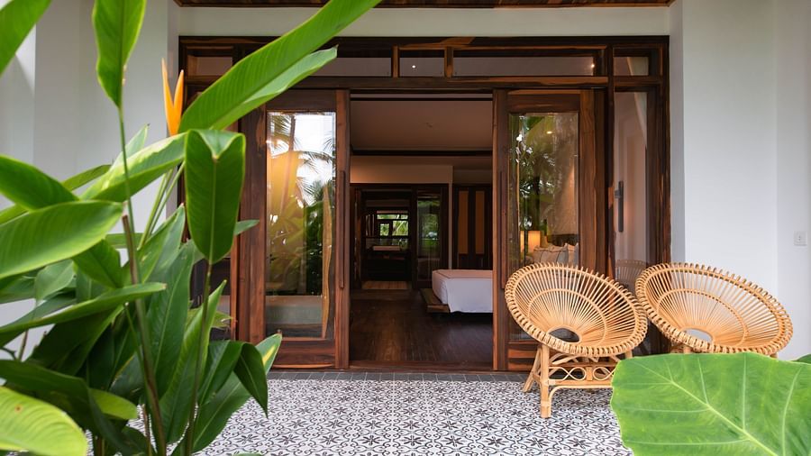 An outdoor image of a building leading to room - Alibu Resort Nha Thrang