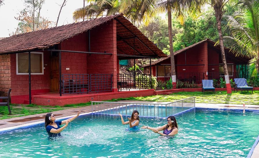 women playing in the swimming pool at Lotus Eco Beach Resort