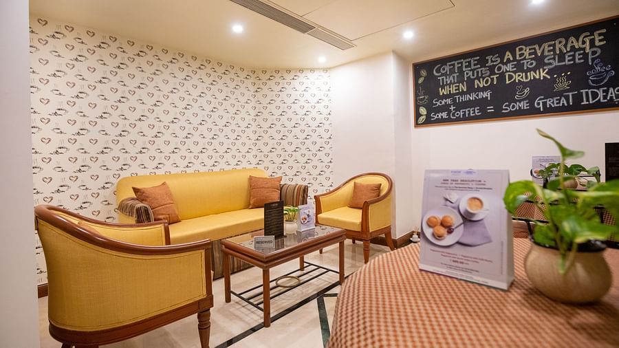 seating area at the gourmet shop - The Orchid Hotel Mumbai Vile Parle