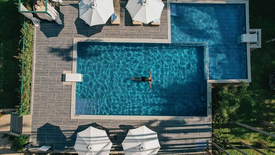 aerial view of the swimming pool with canopies open - Stone Wood Jungle Resort, Dandeli