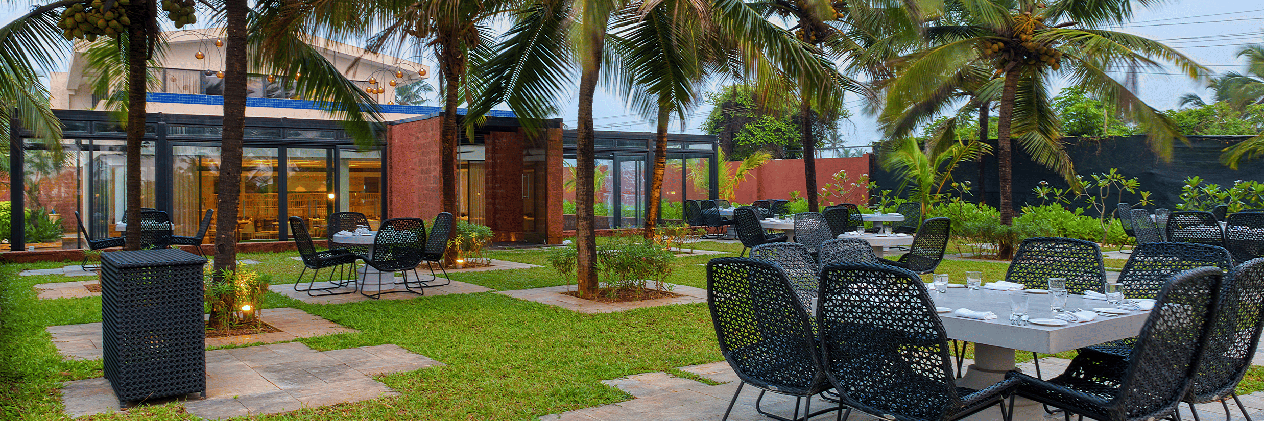 Seating arrangement at La Concha, an alfresco restaurant at Azaya Beach Resort Goa