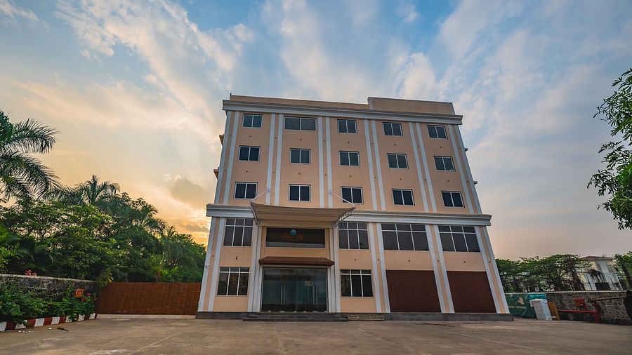 A modern multi-storey hotel building with a spacious outdoor area at Lotus Leaf Boutique Hotel.