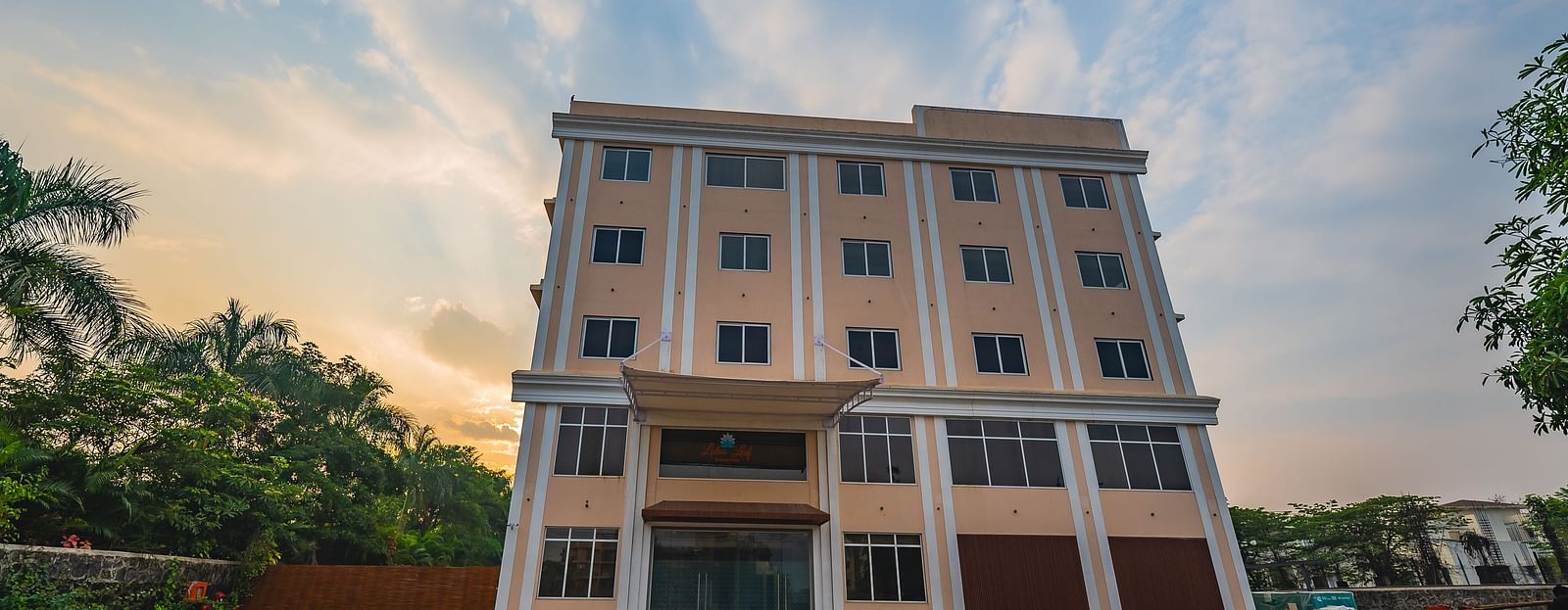 A modern multi-storey hotel building with a spacious outdoor area at Lotus Leaf Boutique Hotel.