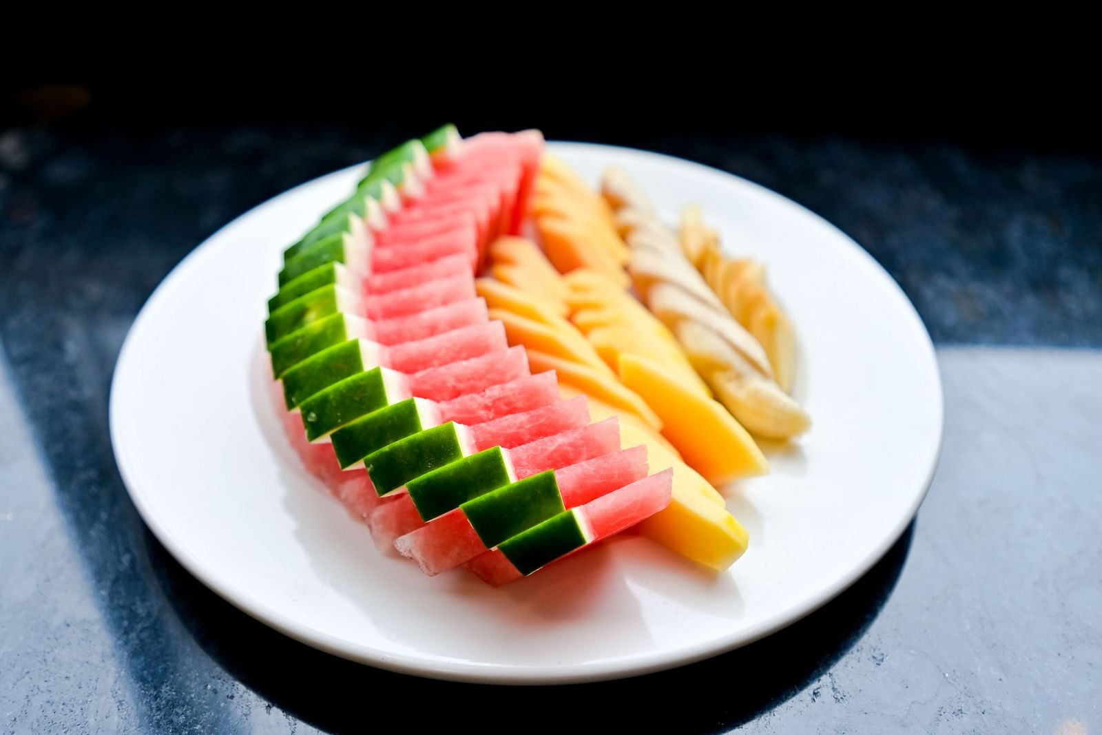 Fruit elegantly arranged on a plate at The Soma Hotel by Avianna Group, Darjeeling