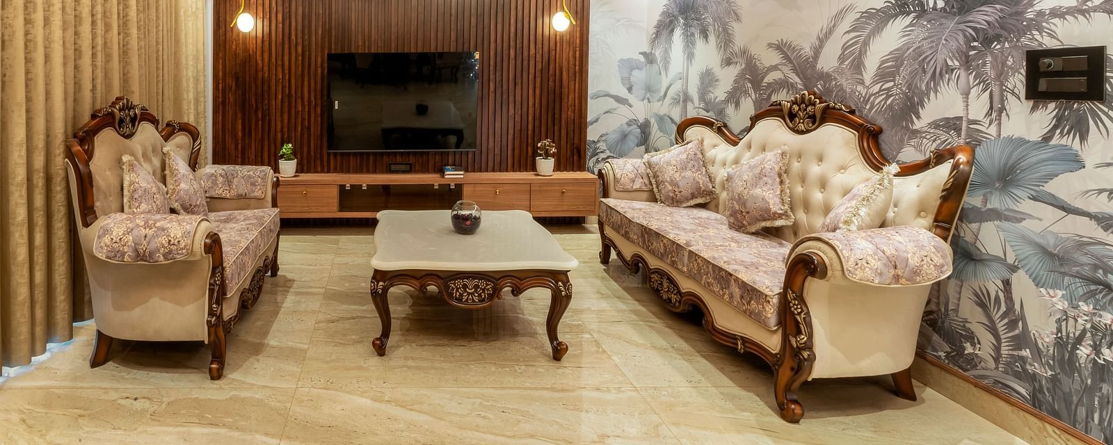 overview of the living room with sofas and a coffee table inside one of the rooms - The Tanisi Hotels & Resorts, Goa
