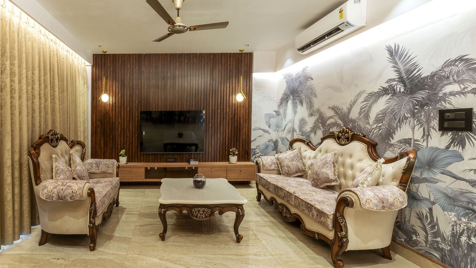 overview of the living room with sofas and a coffee table inside one of the rooms - The Tanisi Hotels & Resorts, Goa