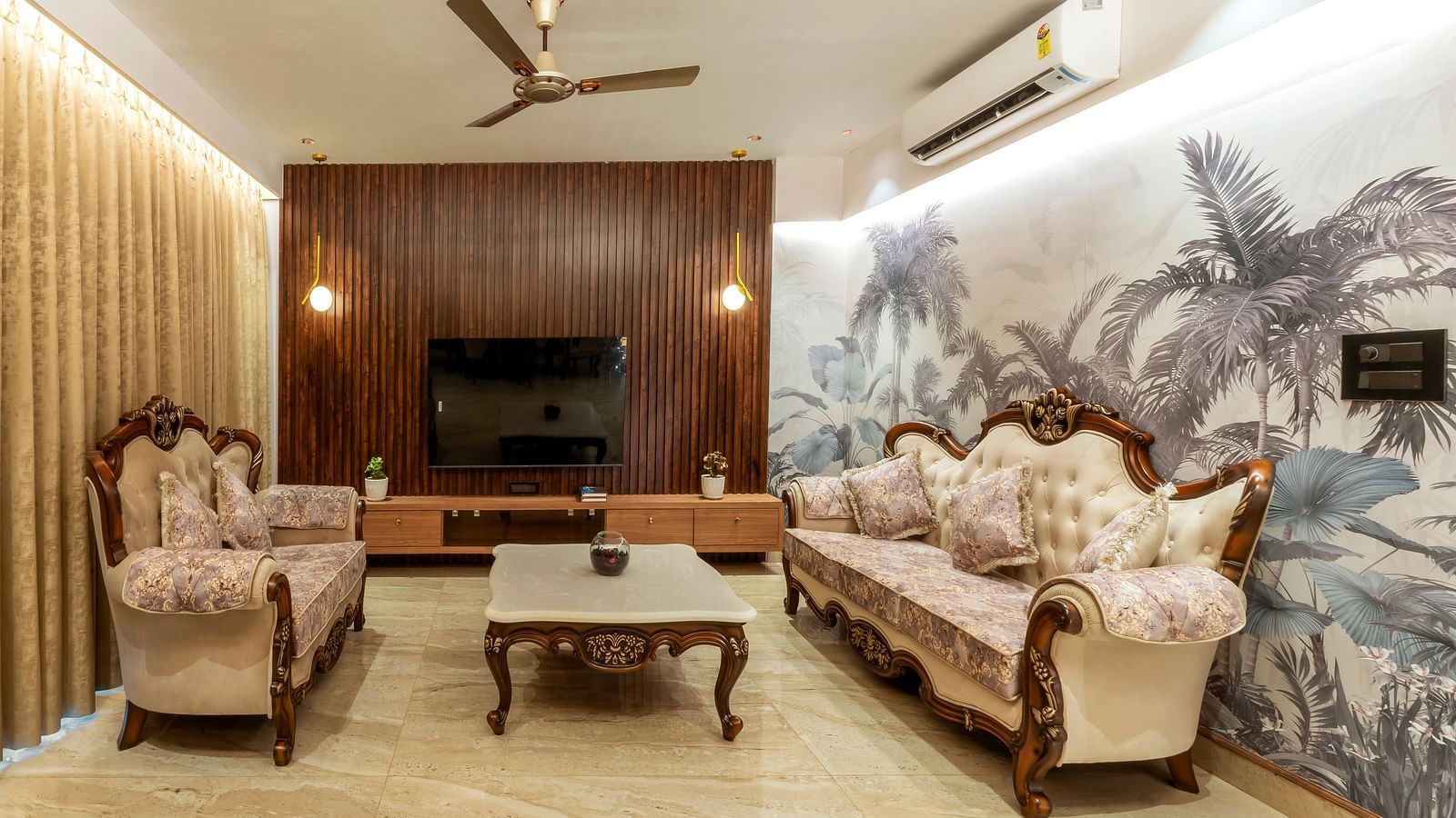 overview of the living room with sofas and a coffee table inside one of the rooms - The Tanisi Hotels & Resorts, Goa
