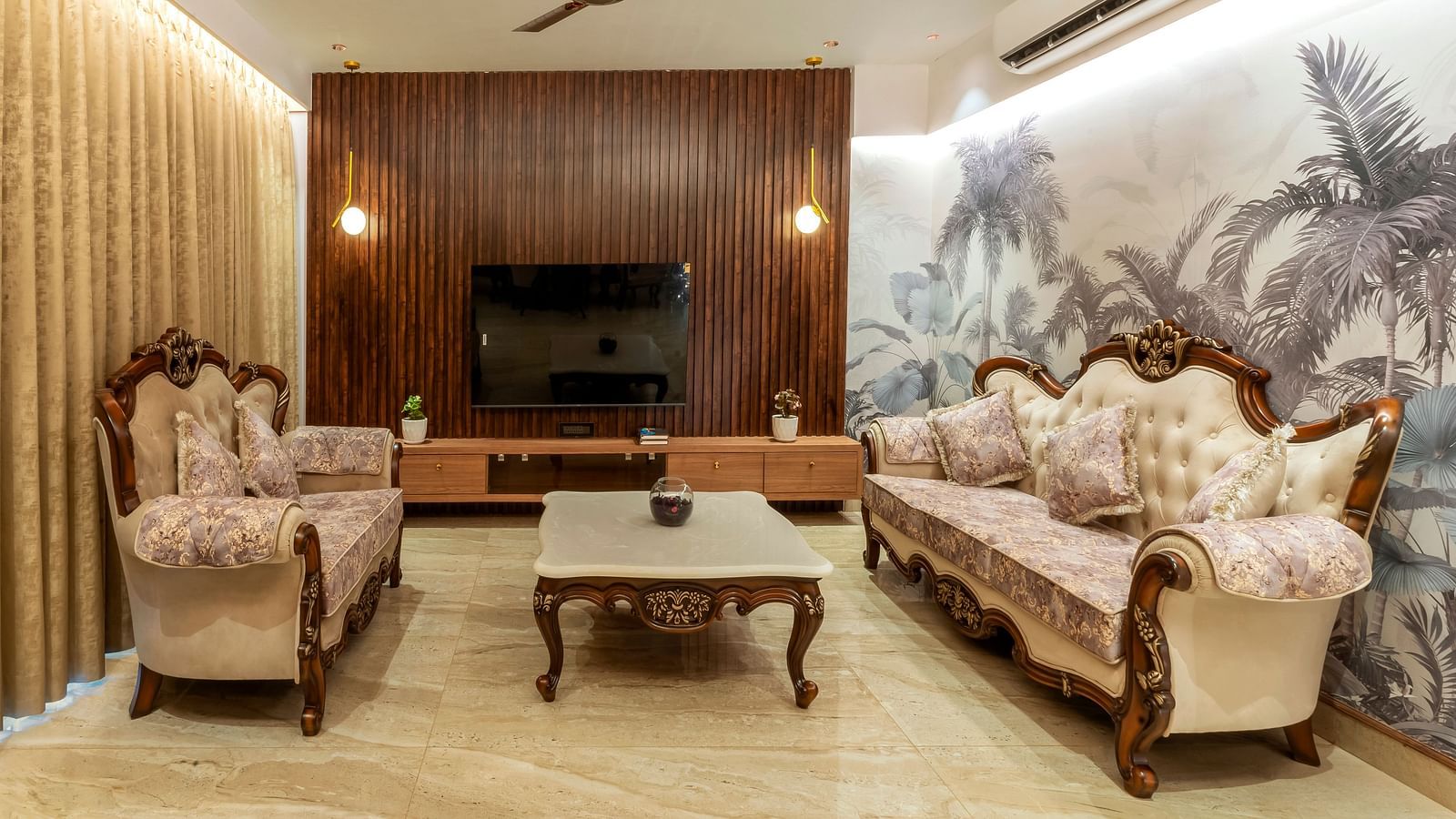overview of the living room with sofas and a coffee table inside one of the rooms - The Tanisi Hotels & Resorts, Goa