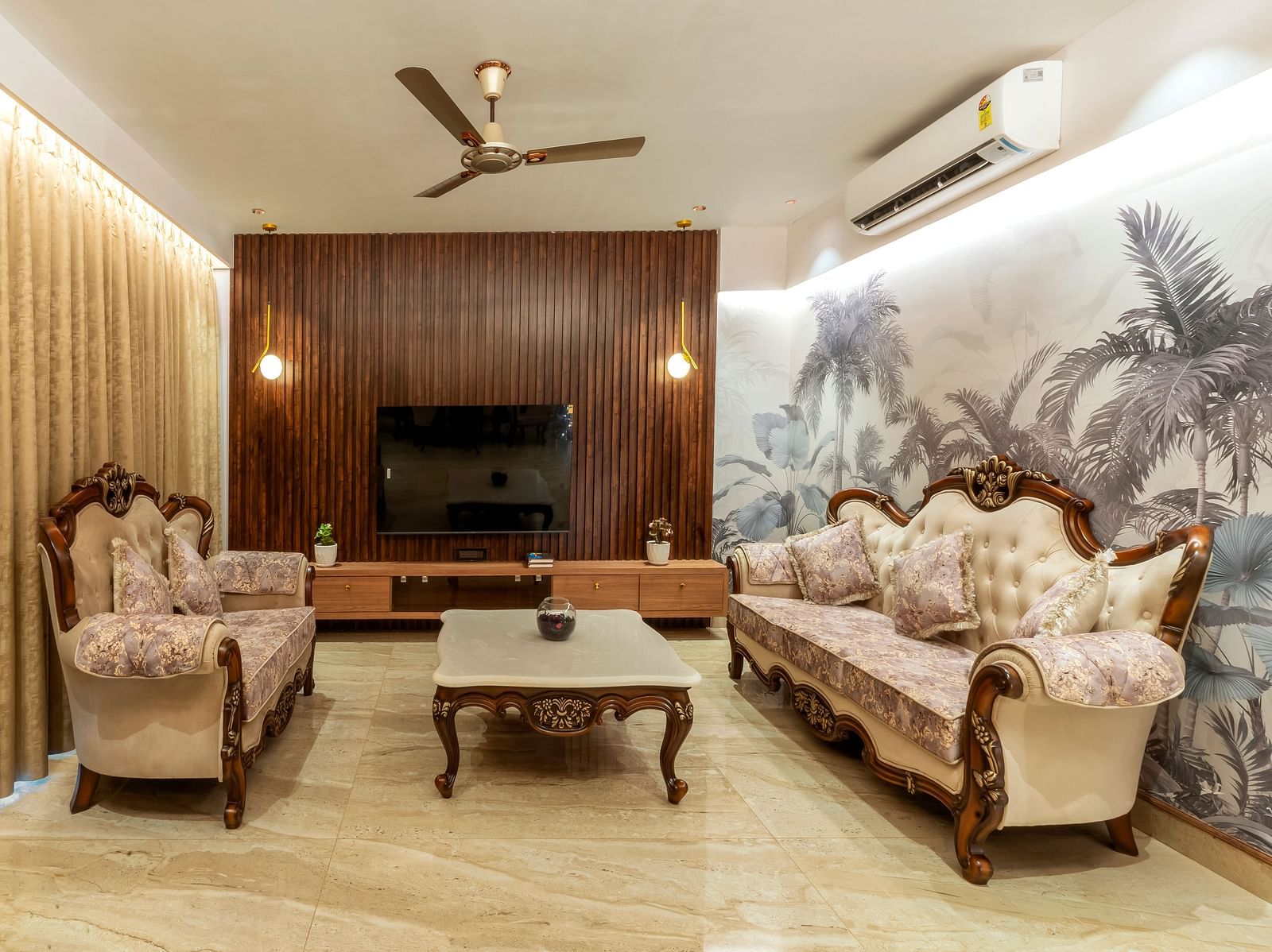 overview of the living room with sofas and a coffee table inside one of the rooms - The Tanisi Hotels & Resorts, Goa