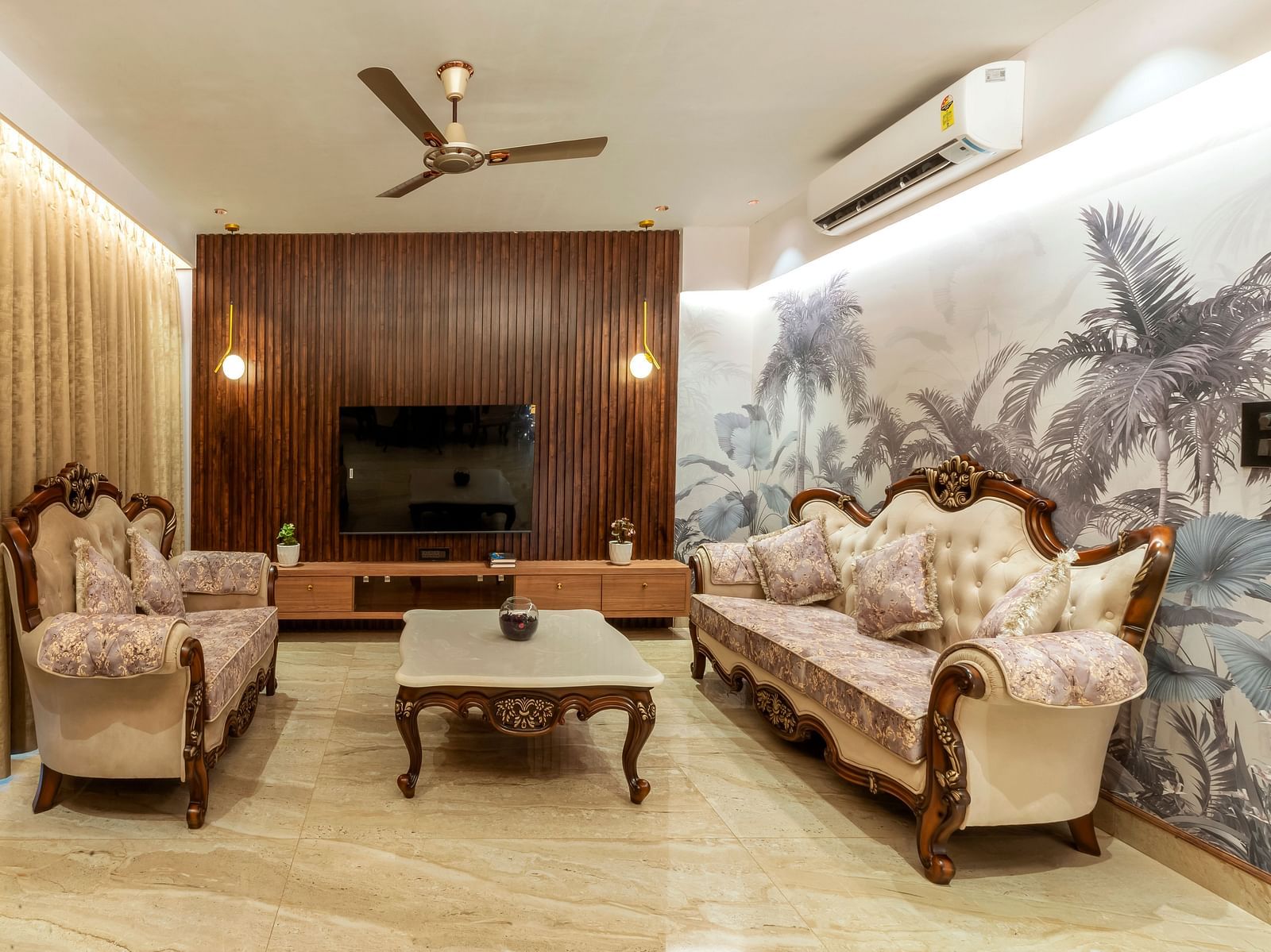 overview of the living room with sofas and a coffee table inside one of the rooms - The Tanisi Hotels & Resorts, Goa