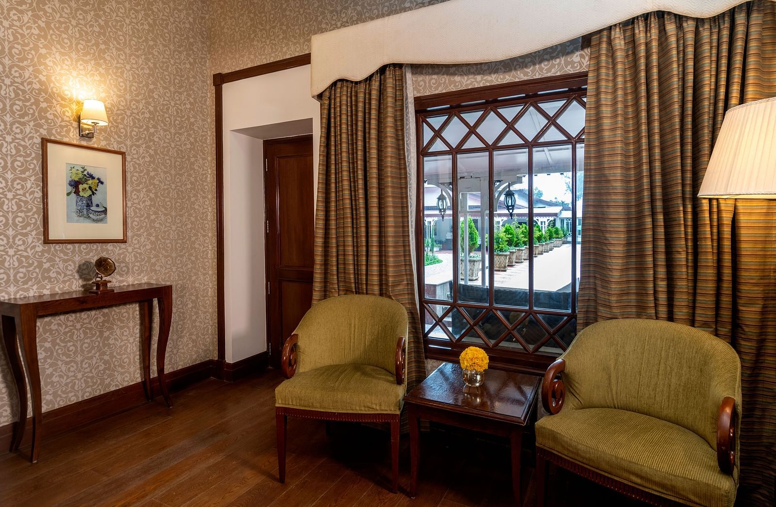 a separate seating area at the Club room at The Claridges Nabha Residence