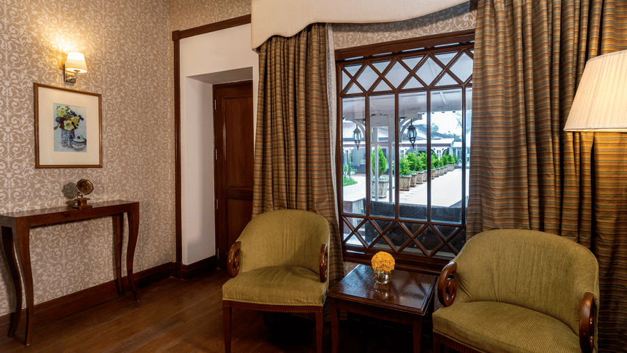 a separate seating area at the Club room at The Claridges Nabha Residence