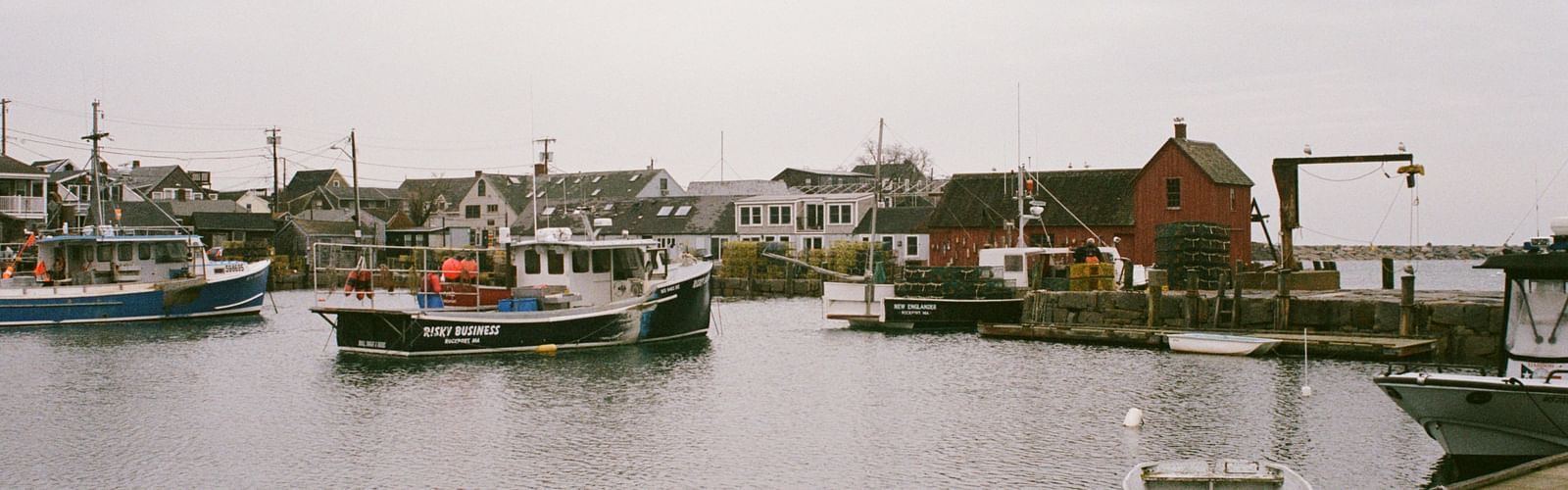 An overview of a pier with many boats in view and an open sky in the background.