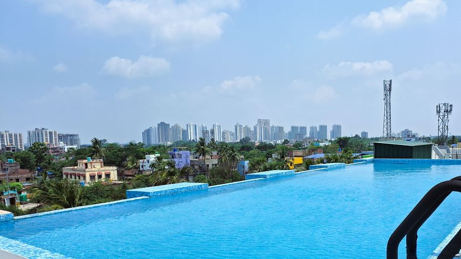 rooftop pool with city views at Starlit Suites, Newtown, Kolkata