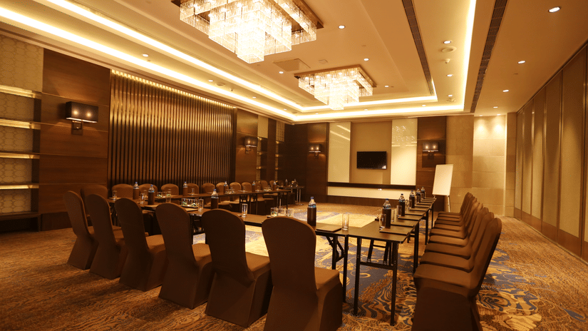 Modern meeting room at Pride Hotel Delhi featuring elegant interiors, comfortable seating, presentation facilities, and a professional setting for business meetings and corporate events.