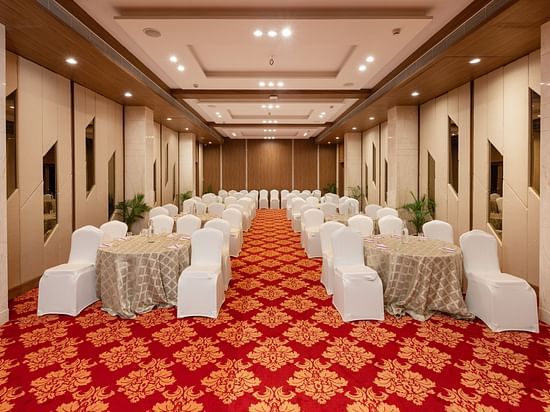 Round table seating arrangements inside the Banquet hall - The Orchid Hotel, Jamnagar