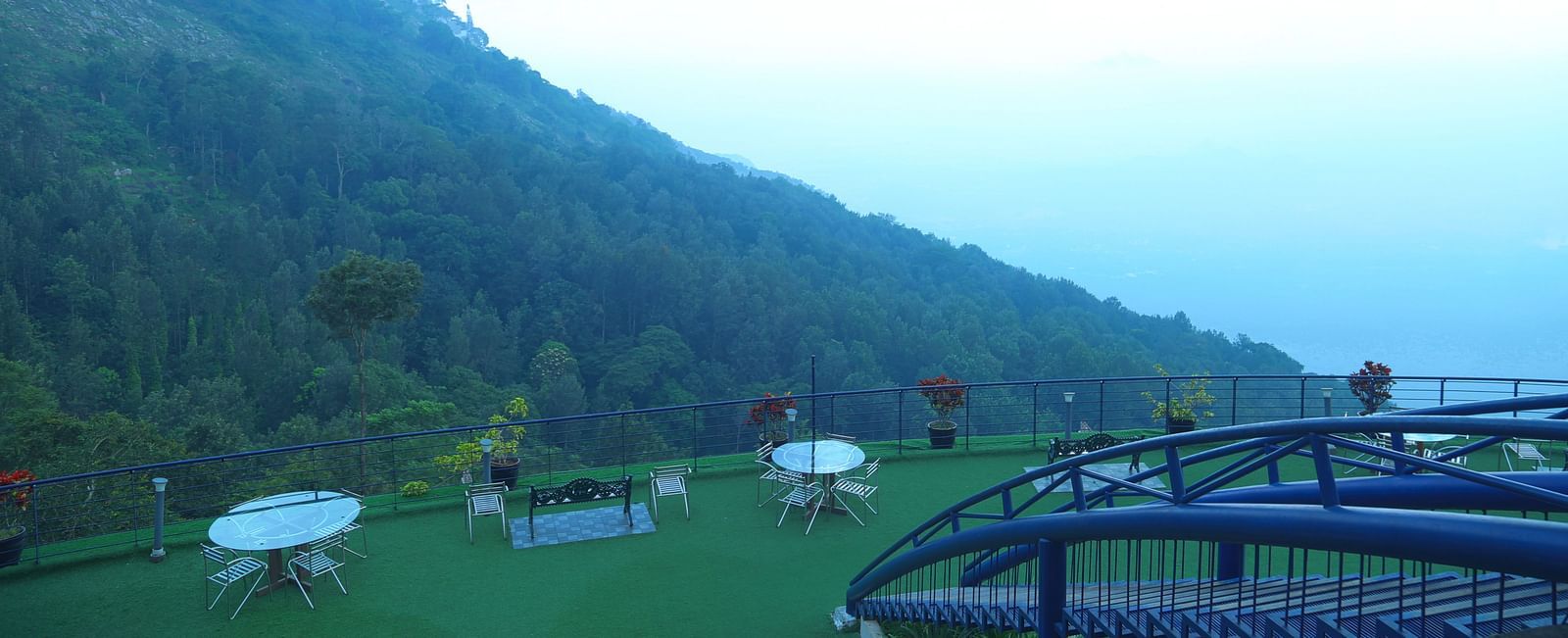 An image of the exterior view from the hotel showcasing the serene mountains - Great Trails Yercaud by GRT Hotels