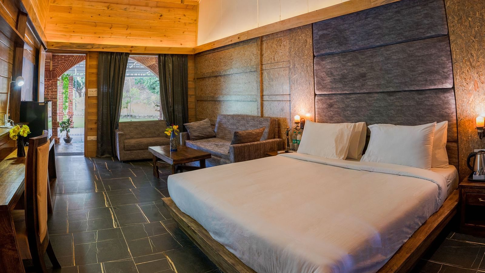 A view of the Master Suite with a large bed at the Sylvan Retreat, Dehradun.