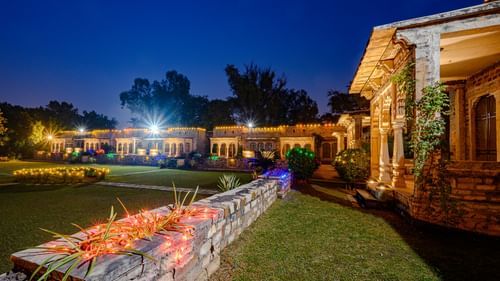 Deo Bagh - 17th Century, Gwalior - the lawn and garden area of the resort in Gwalior during night time